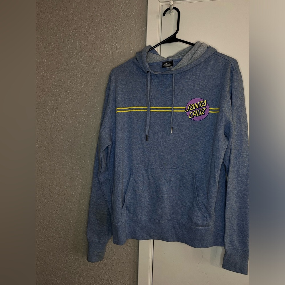 Blue Santa Cruz skateboard sweater.